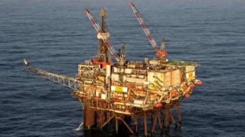 A picture of an offshore platform - Ninian Southern - in the North Sea, with the horizon in the distance.