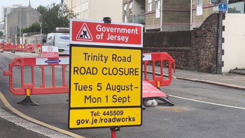 Roadworks that are taking place on Trinity Road. There is a yellow road closure sign which says the work will continue until Monday 1 September. 