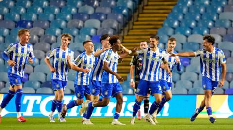 Sheffield Wednesday players celebrate scoring against Leeds