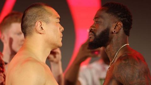 Zhilei Zhang faces off with Deontay Wilder at a weigh-in