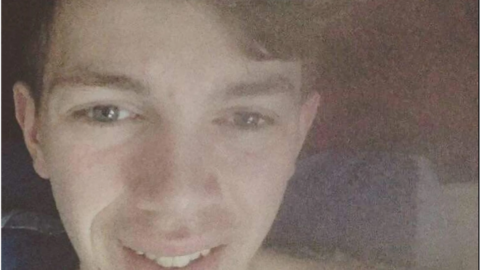 Close-up image of Luke Thompson smiling.