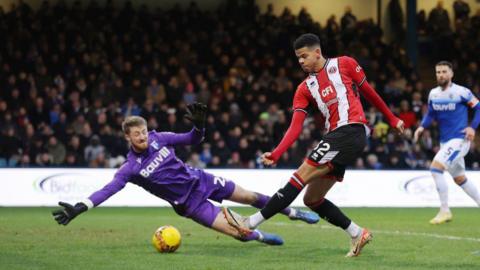 Will Osula of Sheffield United scores their second goal past Jake Turner of Gillingham during the Emirates FA Cup Third Round match between Gillingham and Sheffield United