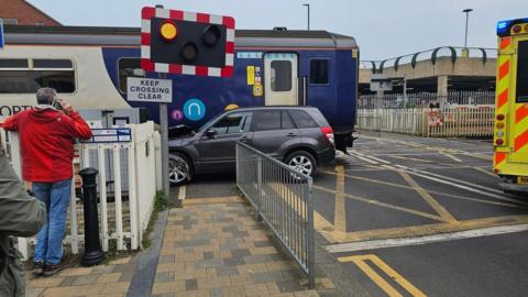 The scene of the level crossing crash showing a car and train