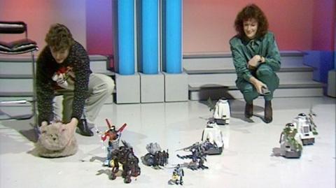 Tomorrow's World Presenters Kieran Prendiville and Judith Hann with a variety of robotic toys.