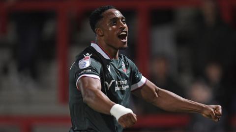 Victor Adeboyejo celebrates scoring at Stevenage