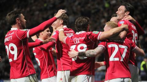 Wrexham players celebrate Kieffer Moore's goal 