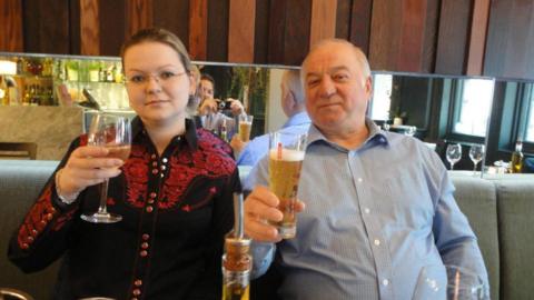 Yulia and Sergei Skripal in a restaurant holding drinks