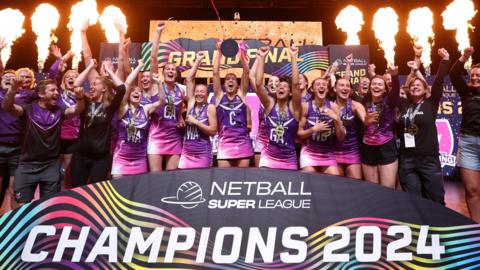 Loughborough Lightning lift the trophy after their teams victory during the Netball Super League 2024 Grand Final match