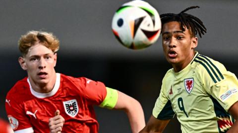 Adam Brett of Wales in action against Valentin Zabransky of Austria