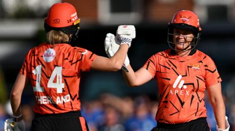 Annabel Sutherland celebrates hitting the winning runs