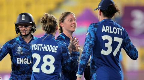 Heather Knight is congratulated by team-mates Em Arlott and Danni Wyatt-Hodge after guiding England past Bangladesh at Cricket World Cup
