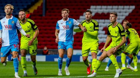 Blackburn Rovers and Sheffield United players challenge for a corner kick