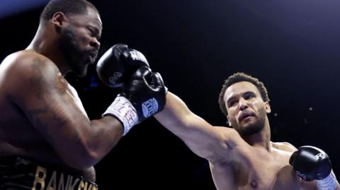 Moses Itauma lands a punch on Jermain Franklin during their fight in Manchester