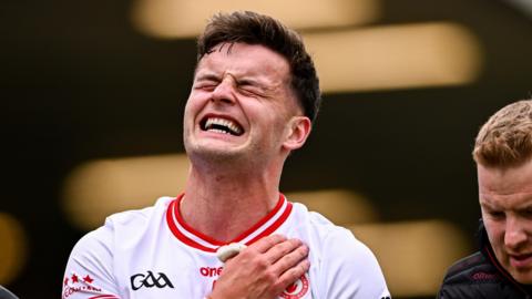 Michael McKernan winces as he leaves the pitch in Tyrone's win over Cavan