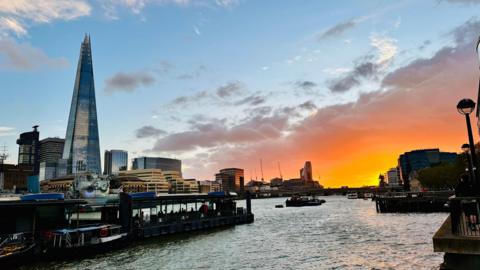 Sunset over the River Thames in London with the Shard prominent on the left of the picture