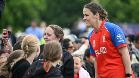 Nat Sciver-Brunt poses for selfie with young supporters