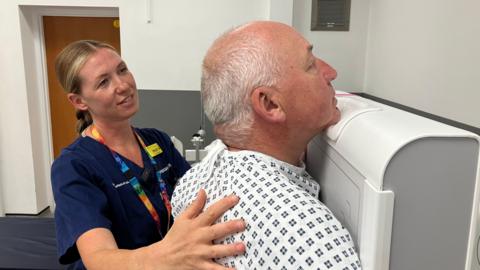 Peter Moult prepares to have a chest X-ray at Coalville Community Hospital,