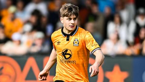 Josh Stokes on the pitch during a Cambridge United match