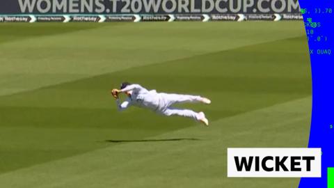 Jacob Bethell flies through the air to catch a ball by New Zealand's Tom Latham.