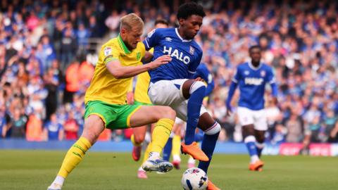 Jaden Philogene of Ipswich Town and Harry Darling of Norwich City contest the ball