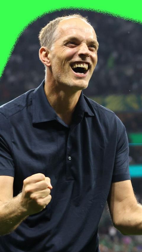 Thomas Tuchel celebrating victory over Mexico. He is wearing a black shirt.