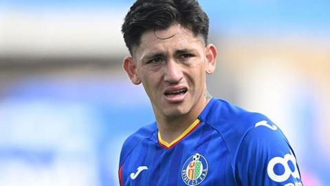 Luis Vazquez in action for Getafe in La Liga. He is wearing a royal blue coloured shirt.