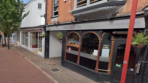 A street image of Park Place, Horsham, showing the exterior of Mungo's cocktail bar.