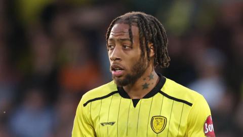 Jamaica international striker Rumarn Burrell in action for Burton