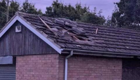 Roof with hole in and slates missing