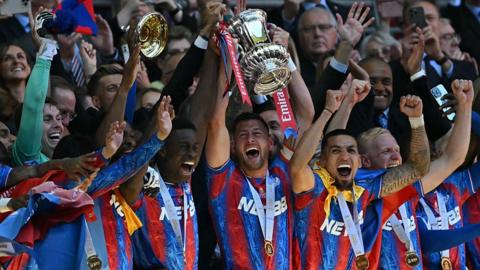Crystal Palace players celebrate lifting the FA Cup
