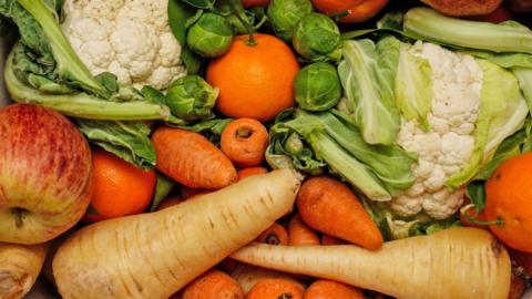 A crate of fresh fruit and vegetables.
