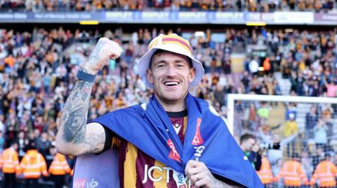 Andy Cook celebrates Bradford City's promotion