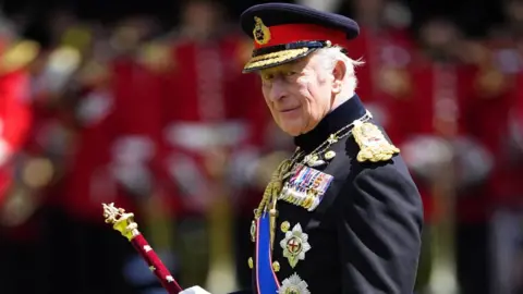 King Charles III during a ceremony to present the Grenadier Guards with their new Colours at Buckingham Palace in London on Tuesday June 9