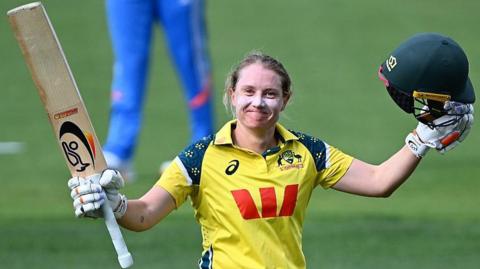 Alyssa Healy of Australia celebrates scoring a century during game three of the women's one-day international series between Australia and India at Bellerive Oval