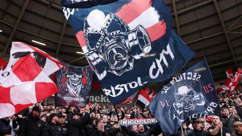 Supporters at Ashton Gate hold up banners