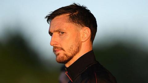 Dom Hyam looks on as he arrives at the ground