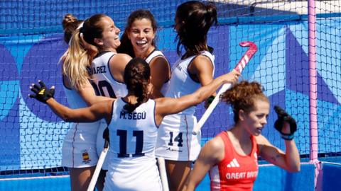 Spain celebrate scoring against Great Britain