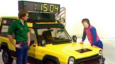 Blue Peter presenters Simon Groom and Peter Duncan with a timing car which will be used in the London Marathon.