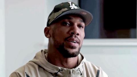 Anthony Joshua sits in front of a camera for a Youtube video