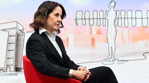 Secretary of State for Work and Pensions Liz Kendall, sits in a red chair as she waits to be interviewed on Sunday with Laura Kuenssberg.