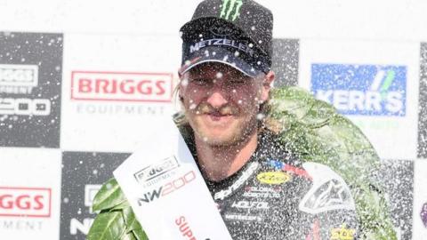Davey Todd sprays the champagne
