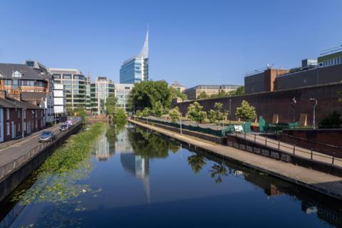 A view of the canal through Reading showing the town scape in the background