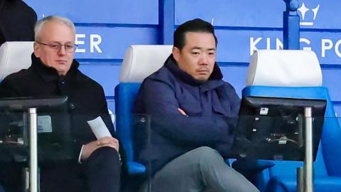 Leicester City owner Khun Aiyawatt 'Top' Srivaddhanaprabha (right) sat in the stands at the King Power Stadium with Foxes director or football Jon Rudkin