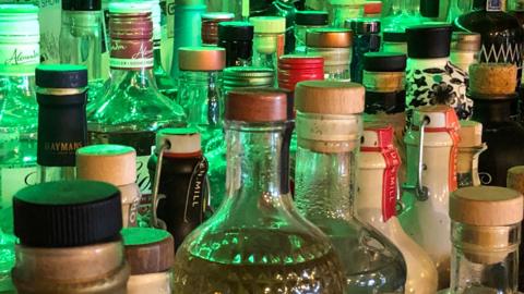 A close-up photo of a number of bottles of liquor