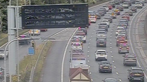 Image from Highways England traffic camera shows traffic at a standstill on the M60 motorway