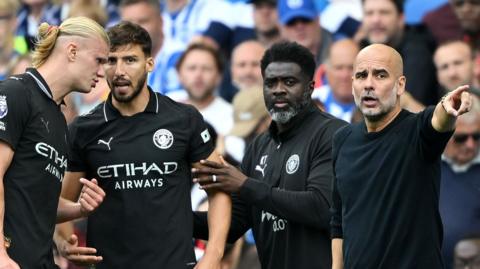 A picture showing Pep Guardiola on the touchline in the Brighton match directing his team
