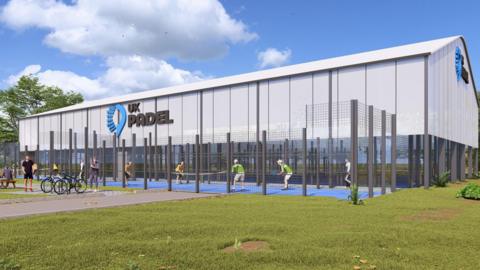 An artist's impression of what the new padel facility could look like showing two outdoor courts, with people playing on them, next to a grey building, and grass area in front. There is a UK PADEL logo on the side of the building, which looks like a sports hall.