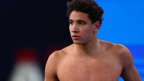 Ahmed Hafnaoui poolside during the 2024 World Aquatics Championships