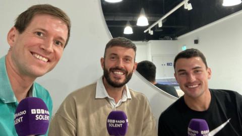 Andrew Moon, Chris Wise and Regan Poole pose for a photo 