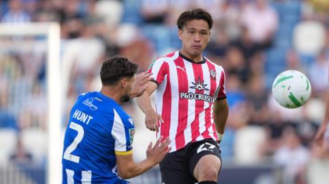 Southampton midfielder Kuryu Matsuki plays a pass ahead of Rob Hunt